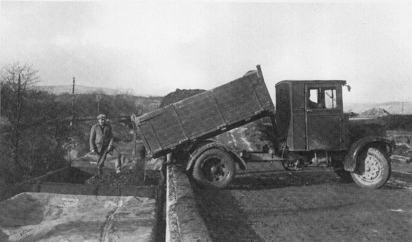 Lorry unloading clay at East Golds siding, built 1938