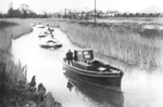 The tug Heron towing loaded clay barges down the Whitelake Channel  - click on the picture to view a larger version
