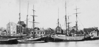Poole Quays, clay being loaded into vessels for the Mersey and other ports.